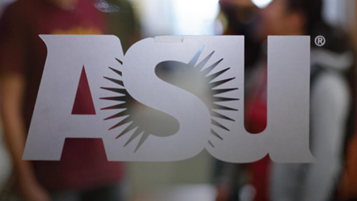 The ASU logo in frosted glass on a clear glass window.